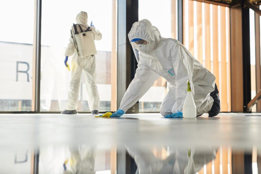 two workers doing chemical cleaning indoors 2021 09 24 04 06 08 utc 1