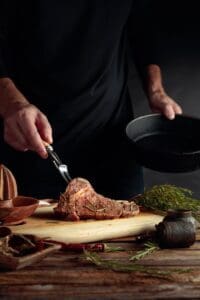 Chef,Prepare,Steak.,Uncooked,Steak,In,Sauce,With,Spices,An