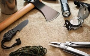 Various,Equipment,For,Survival,On,Jute,Fabric