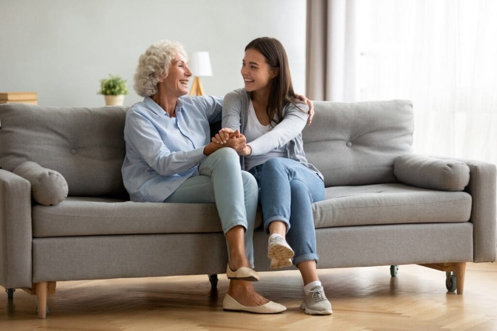 Happy,Adult,Granddaughter,And,Senior,Grandmother,Having,Fun,Enjoying,Talk