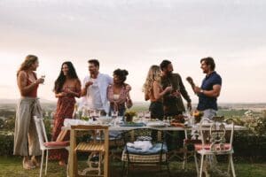 Group,Of,Friends,Having,Drinks,At,Party,In,Garden.,Millennials