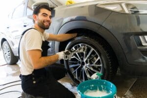 Happy,Young,Mexican,Male,Employee,Washing,A,Vehicle,At,Car