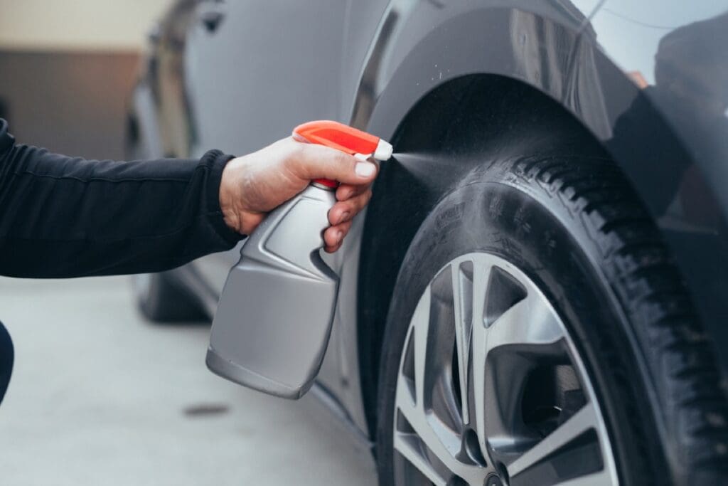 Close,Up,Man,Cleaning,Car,Tires,In,Carwash,Service