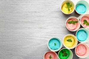 Ice,Cream,Collection,In,Paper,Cups,On,Wooden,Background
