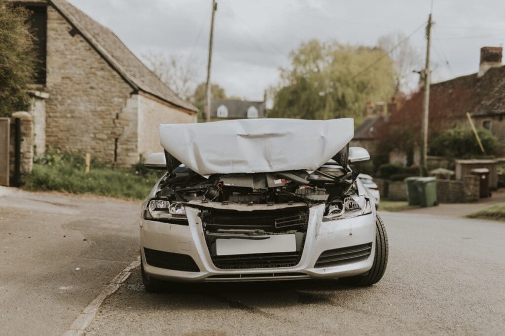 Wrecked car parked on the street after a car crash