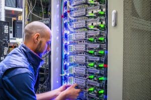 A,Man,Works,With,Telecommunications.,The,Technician,Switches,The,Internet