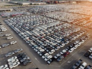 Aerial view a lot of car for import and export shipping by ship.