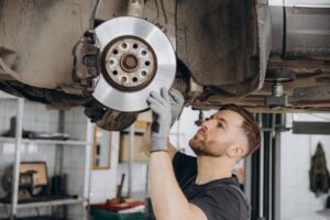 View,From,Side,Of,Concentrated,Worker,Of,Car,Service,Checking